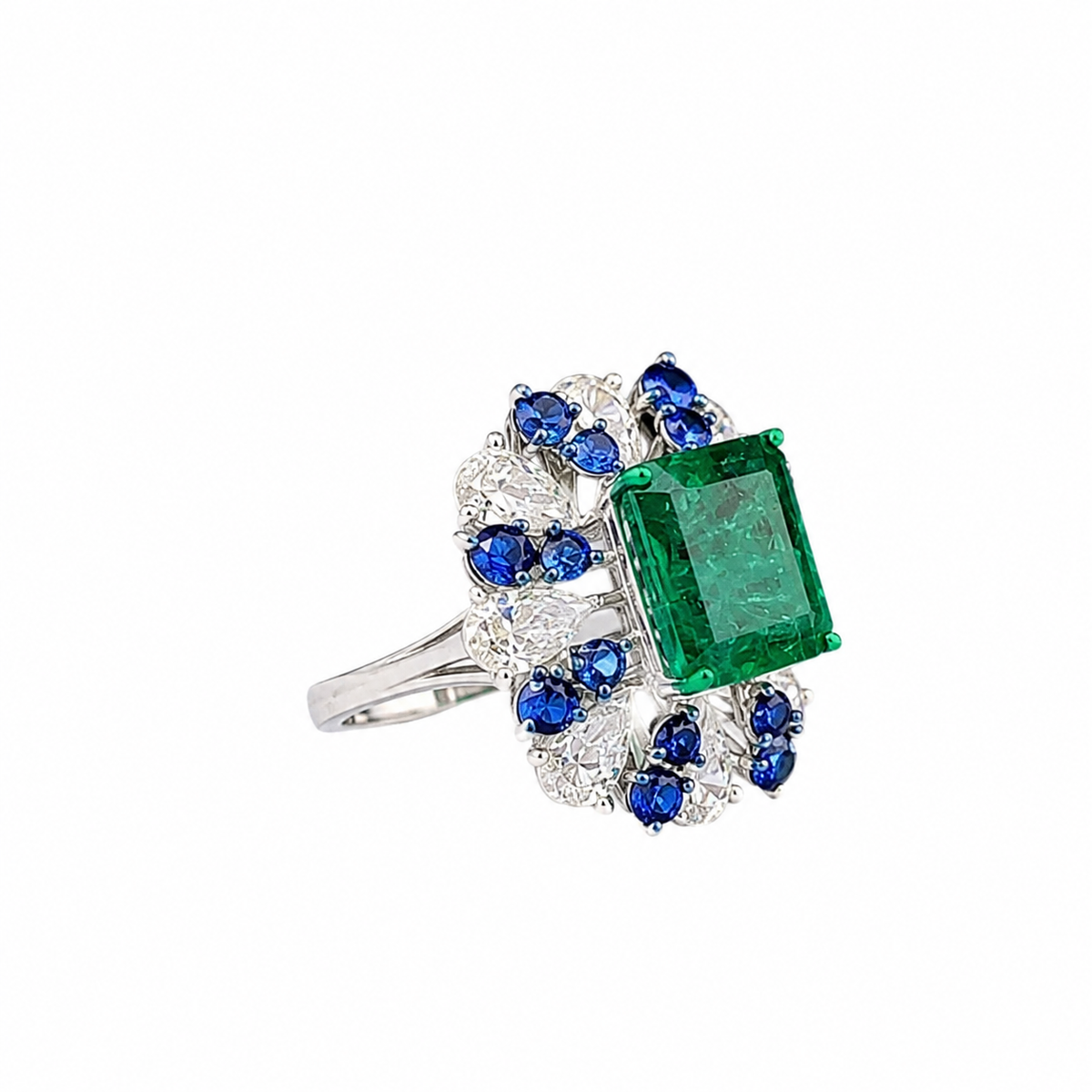 Emerald Cut Emerald & Diamond Halo Ring with Blue Sapphire Accents